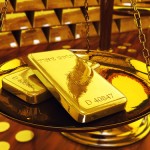 Gold futures hover as questions about stimulus persist